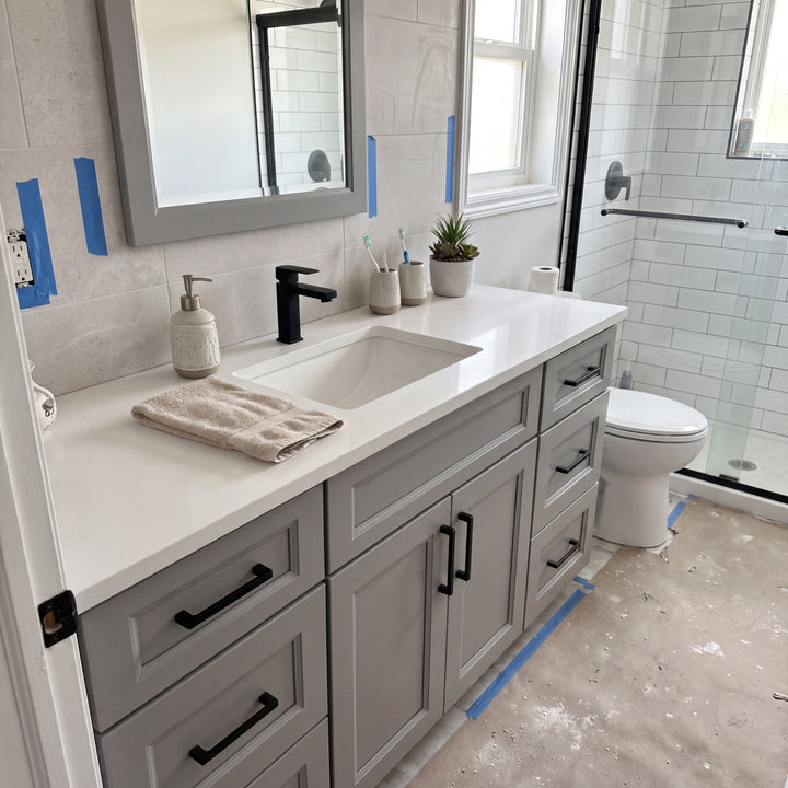 Tesoro 48" Grey Shaker vanity mid-install from the side in a Canadian bathroom