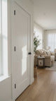 Shaker 2-Panel Solid Wood Door shown in a modern room