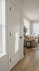Shaker 2-Panel Solid Wood Door shown in a modern room