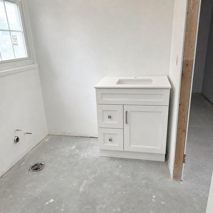 Tesoro 30-inch white Shaker solid wood bathroom vanity newly installed in a bathroom renovation