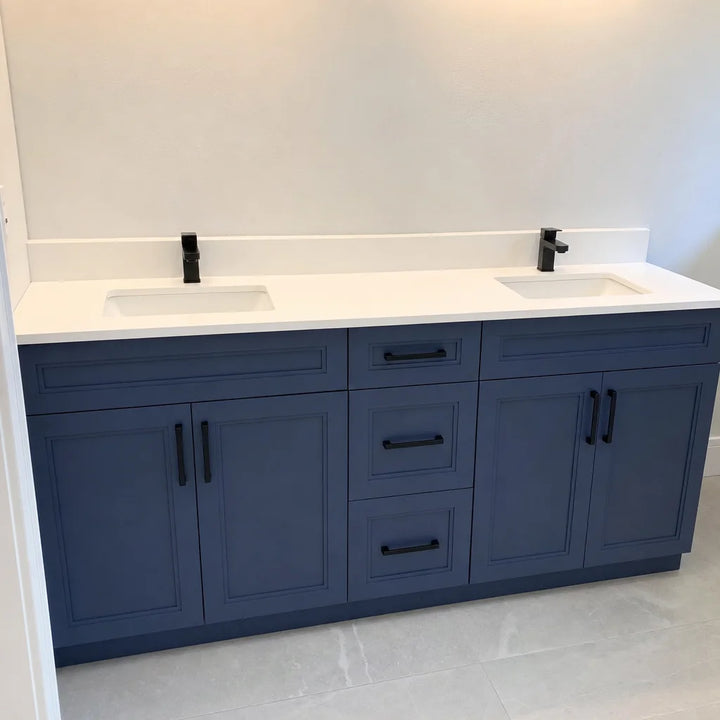 Tesoro 60-inch navy blue double sink Shaker solid wood bathroom vanity with black handles and white quartz countertop in a modern bathroom