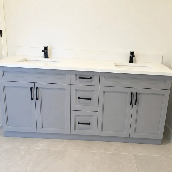 Tesoro 60-inch grey double sink Shaker solid wood bathroom vanity with black handles in a modern bathroom with grey tile floor