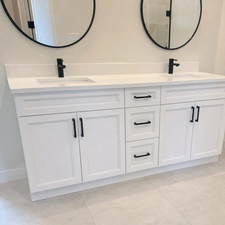 Tesoro 72-inch white double sink Shaker solid wood bathroom vanity with black handles and twin round mirrors in a bright bathroom