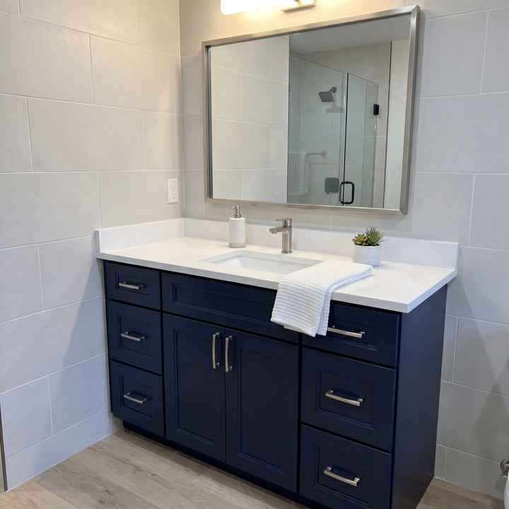 Tesoro 48" Blue Shaker vanity beside a glass shower in a Canadian home