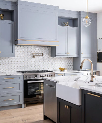 home care supply kitchen with blue cabinets and gold accents creating a stylish and elegant atmosphere